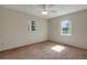 A bedroom with carpet, ceiling fan, and natural light at 3147 Sydney Dover Rd, Dover, FL 33527