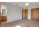 Bedroom with an adjoining bathroom, ceiling fan, and a double door closet at 3147 Sydney Dover Rd, Dover, FL 33527