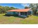 Cozy one-story home with metal roof and a screened-in porch, set on a well-maintained lawn with curb appeal at 3147 Sydney Dover Rd, Dover, FL 33527