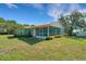 Charming single-story home with well-maintained lawn, inviting exterior, and metal roof at 3147 Sydney Dover Rd, Dover, FL 33527