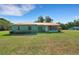 Charming single-story home with well-maintained lawn, inviting exterior, and metal roof at 3147 Sydney Dover Rd, Dover, FL 33527