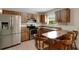 Functional kitchen featuring wood cabinets, stainless steel appliances, and a breakfast bar at 3147 Sydney Dover Rd, Dover, FL 33527