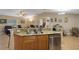 Kitchen featuring stainless steel appliances and granite countertops open to living room at 3147 Sydney Dover Rd, Dover, FL 33527