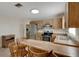 Kitchen featuring wood cabinets, stainless steel appliances, and a wooden breakfast bar at 3147 Sydney Dover Rd, Dover, FL 33527