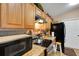 Well-equipped kitchen featuring stainless steel appliances, granite countertops, and ample cabinet space at 3147 Sydney Dover Rd, Dover, FL 33527