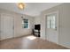 View of the open-plan living area featuring tile flooring, neutral paint, and exterior doors at 3147 Sydney Dover Rd, Dover, FL 33527