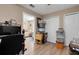 A room with light-colored walls with laminate floors is being used as a storage area at 3147 Sydney Dover Rd, Dover, FL 33527
