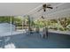 Spacious covered patio with seating, offering ample space for outdoor relaxation and entertainment at 3147 Sydney Dover Rd, Dover, FL 33527