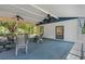 Wide covered patio with blue floor, outdoor seating, ceiling fans, and screened in enclosure at 3147 Sydney Dover Rd, Dover, FL 33527