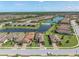 Beautiful aerial view of a community with well-maintained homes and lush landscaping surrounding serene lakes at 3167 Forsythia Dr, Odessa, FL 33556