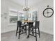 Dining area with modern chandelier and large windows at 3167 Forsythia Dr, Odessa, FL 33556