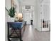 Light-filled entryway features tile floors and a view of the home's stylish decor at 3167 Forsythia Dr, Odessa, FL 33556