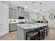 Beautiful open kitchen featuring a large island, breakfast bar, and stainless appliances at 3167 Forsythia Dr, Odessa, FL 33556