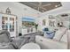 Living room with large TV and built-in storage at 3167 Forsythia Dr, Odessa, FL 33556