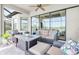Comfortable screened patio seating area, with beautiful lake view through large sliding glass doors at 3167 Forsythia Dr, Odessa, FL 33556