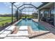 Relaxing screened pool with sun loungers, perfect for enjoying the Florida sunshine at 3167 Forsythia Dr, Odessa, FL 33556