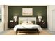 Comfortable bedroom features a white bed frame with accent pillows and matching nightstands at 31890 Griffin Sands Ln, San Antonio, FL 33576