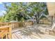 Spacious wood back deck with wood railings shows a beautiful outdoor living area with a neighborhood view at 3320 Jackson N St, St Petersburg, FL 33704