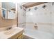 Bathroom with a tub and shower combo, decorative tiling, and classic fixtures at 3320 Jackson N St, St Petersburg, FL 33704