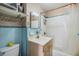 Compact bathroom with a shower/tub and a classic blue and white tile scheme at 3320 Jackson N St, St Petersburg, FL 33704