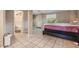 Bedroom with tile flooring, a bed, and access to an outdoor area at 3320 Jackson N St, St Petersburg, FL 33704