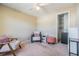Cozy bedroom featuring a comfortable chair, ottoman, and closet space at 3320 Jackson N St, St Petersburg, FL 33704