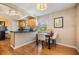 Cozy dining area features wood cabinets, stainless steel appliances, and view to the outdoor at 3320 Jackson N St, St Petersburg, FL 33704