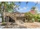 Beautiful two-story home featuring a large wooden deck and landscaped yard at 3320 Jackson N St, St Petersburg, FL 33704