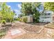 Detached garage surrounded by beautiful landscaping, providing privacy and functionality at 3320 Jackson N St, St Petersburg, FL 33704