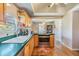 Kitchen featuring wooden cabinets, stainless steel appliances, hardwood floors and a view to the next room at 3320 Jackson N St, St Petersburg, FL 33704