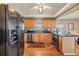 Charming kitchen with wood cabinets, modern stainless steel appliances, and hardwood floors at 3320 Jackson N St, St Petersburg, FL 33704