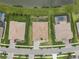 Aerial view of properties, showcasing backyard layouts, landscaping, and proximity to neighborhood amenities at 33219 Kateland Dr, Wesley Chapel, FL 33545