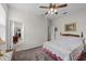 Bedroom featuring a ceiling fan, carpet, and dresser at 33219 Kateland Dr, Wesley Chapel, FL 33545