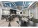 A well-lit clubhouse interior provides dining and lounge seating in a modern design at 33219 Kateland Dr, Wesley Chapel, FL 33545