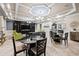 A clubhouse interior features a large entertainment center, kitchen, and comfortable lounge seating at 33219 Kateland Dr, Wesley Chapel, FL 33545