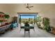 Outdoor lanai featuring a fountain, plants, and views of the lake at 33219 Kateland Dr, Wesley Chapel, FL 33545