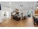 Bright living room with an open layout that features hardwood floors and a cozy stone fireplace at 33219 Kateland Dr, Wesley Chapel, FL 33545