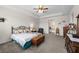 The main bedroom features a comfortable carpet, tray ceiling, and space for relaxing and unwinding at 33219 Kateland Dr, Wesley Chapel, FL 33545