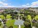 A community playground and park area features a lake view, basketball court, and play equipment at 33219 Kateland Dr, Wesley Chapel, FL 33545