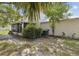 Enjoy the peaceful backyard with screened patio, mature trees, and space for outdoor activities at 3411 Landover Blvd, Spring Hill, FL 34609