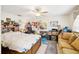 Cluttered bedroom featuring ceiling fan, desk, and TV at 3411 Landover Blvd, Spring Hill, FL 34609