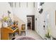 Spacious entryway with high ceilings, decorative wall accents, and a clear view of the front door at 3411 Landover Blvd, Spring Hill, FL 34609