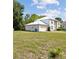 Spacious two-story home with a garage and ample lawn space, ideal for families and outdoor fun at 3411 Landover Blvd, Spring Hill, FL 34609