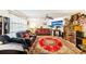 Inviting living room featuring two couches, a ceiling fan, and a decorative rug at 3411 Landover Blvd, Spring Hill, FL 34609
