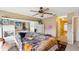 Comfortable main bedroom with mirrored wall and ensuite bathroom access at 3411 Landover Blvd, Spring Hill, FL 34609