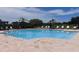 Sparkling community pool with lounge chairs and lush landscaping provides relaxation and recreation at 4444 Aqua Mirage St, Sarasota, FL 34238