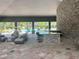 View of the community pool and outdoor kitchen featuring ample seating and lounge area at 4444 Aqua Mirage St, Sarasota, FL 34238