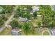 Aerial view of a beautiful home and property with mature trees and greenery at 4783 School Rd, Land O Lakes, FL 34638