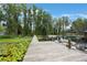 Picturesque view of a private dock with a boat, surrounded by lush greenery on the waterfront at 4783 School Rd, Land O Lakes, FL 34638