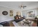Inviting living room features a ceiling fan, built-in shelving and an open concept at 4783 School Rd, Land O Lakes, FL 34638